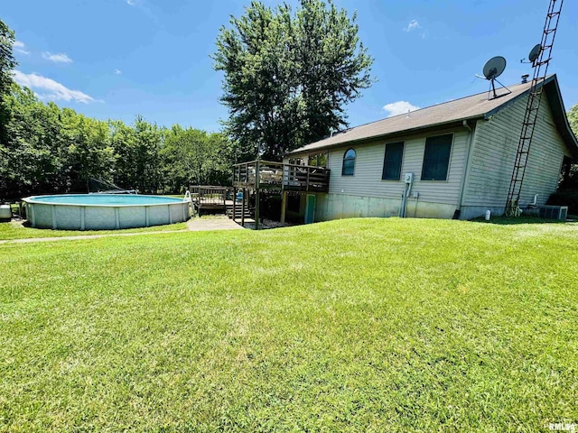 348 Medlin Rd, Walnut Hill, IL 62893 - view of green lawn featuring a deck and an outdoor pool