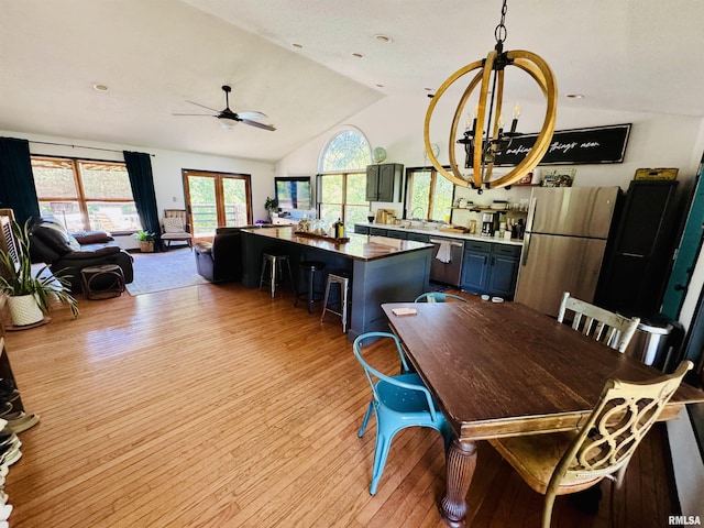 348 Medlin Rd, Walnut Hill, IL 62893 - dining area with light wood finished floors, vaulted ceiling, a ceiling fan, and a chandelier
