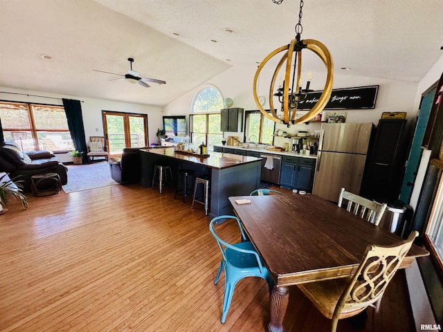 348 Medlin Rd, Walnut Hill, IL 62893 - dining area with vaulted ceiling, light wood-style flooring, a ceiling fan, and a chandelier