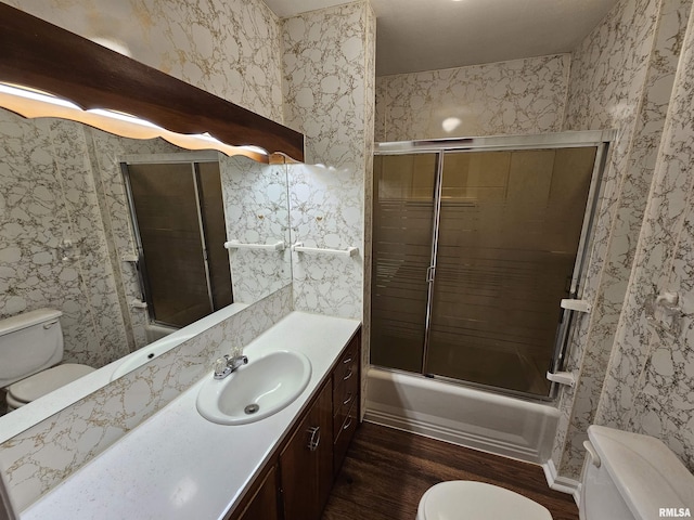 2500 Perkins Ave, Mount Vernon, IL 62864 - full bath with wood finished floors, vanity, and bath / shower combo with glass door