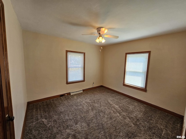 2500 Perkins Ave, Mount Vernon, IL 62864 - unfurnished room featuring plenty of natural light, dark colored carpet, and ceiling fan