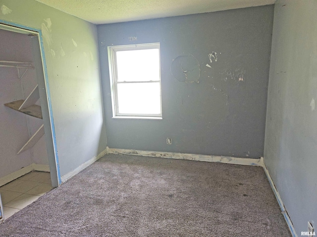 1605 E Pickett Ln, Marion, IL 62959 - carpeted empty room featuring a textured ceiling and baseboards