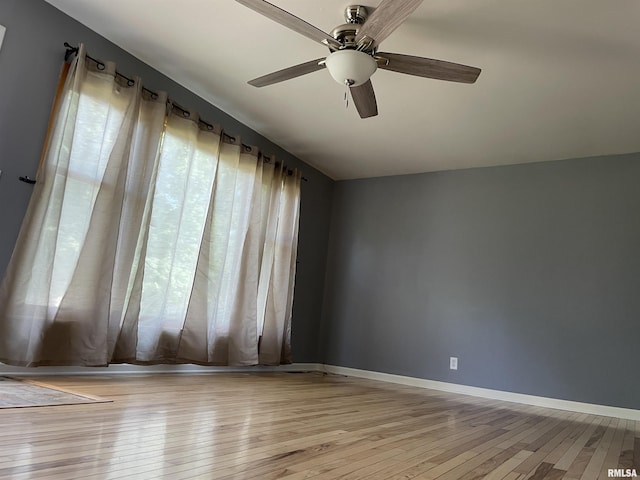 304 S Plover Dr, Carbondale, IL 62901 - empty room with light wood-style flooring and a ceiling fan