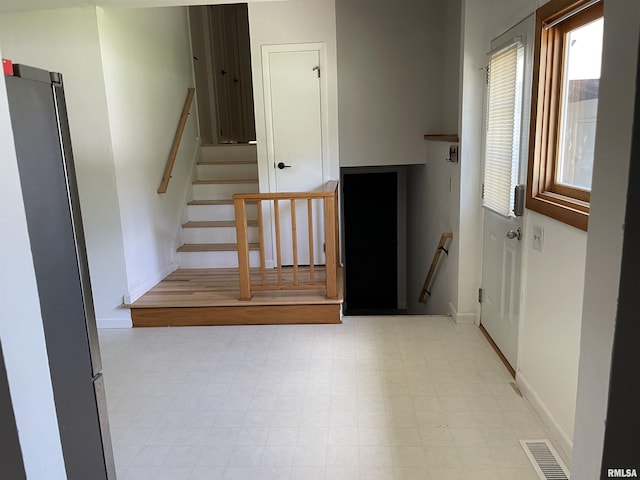 304 S Plover Dr, Carbondale, IL 62901 - stairs with tile patterned floors and baseboards