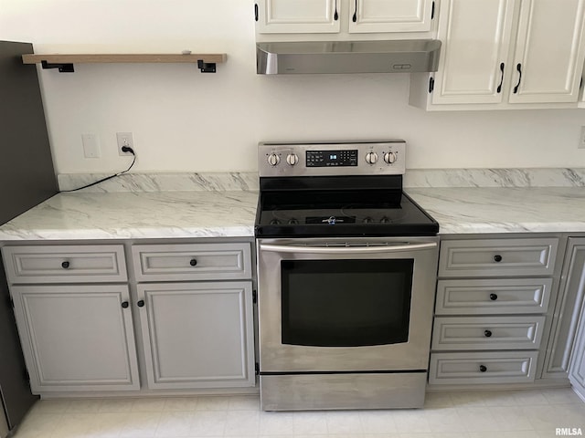 304 S Plover Dr, Carbondale, IL 62901 - kitchen with electric range, exhaust hood, and gray cabinetry