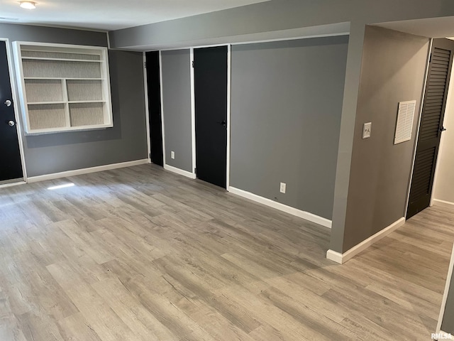 304 S Plover Dr, Carbondale, IL 62901 - spare room featuring wood finished floors and built in shelves
