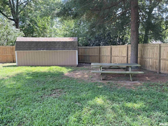 304 S Plover Dr, Carbondale, IL 62901 - fenced backyard featuring a storage unit