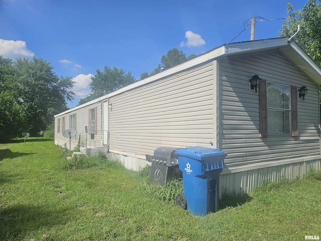 120 E 1st St, Bonnie, IL 62816 - view of property exterior with a yard and entry steps