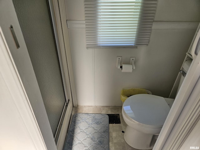 120 E 1st St, Bonnie, IL 62816 - bathroom with toilet and a shower with shower door