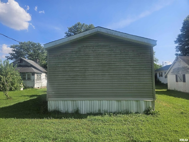 120 E 1st St, Bonnie, IL 62816 - view of home's exterior featuring a lawn