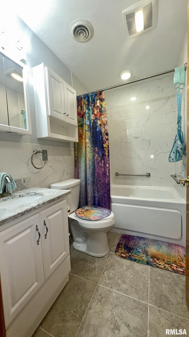 902 N Buchanan St, Benton, IL 62812 - bathroom featuring vanity, shower / bath combo with shower curtain, and tile patterned flooring