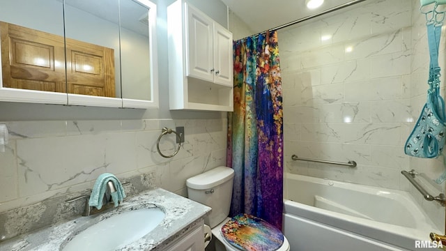 902 N Buchanan St, Benton, IL 62812 - full bath featuring shower / tub combo with curtain, vanity, tasteful backsplash, and tile walls