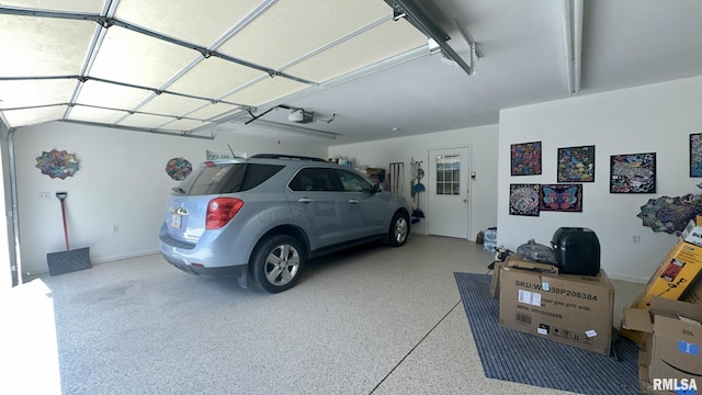 902 N Buchanan St, Benton, IL 62812 - garage with a garage door opener and baseboards