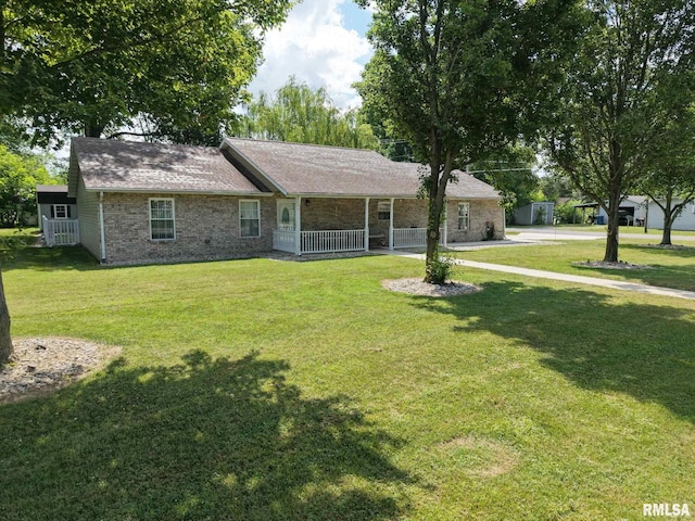 902 N Buchanan St, Benton, IL 62812 - single story home featuring a front yard, covered porch, and brick siding