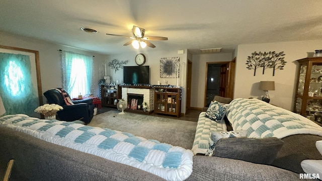 902 N Buchanan St, Benton, IL 62812 - living room featuring carpet floors, ceiling fan, and a fireplace