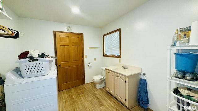 13919 Hamilton Pike Rd, Whittington, IL 62897 - full bath with wood finished floors, separate washer and dryer, vanity, and a bath