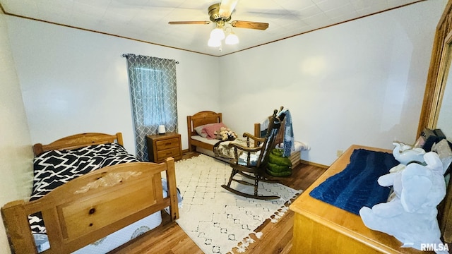 13919 Hamilton Pike Rd, Whittington, IL 62897 - bedroom with wood finished floors and ceiling fan