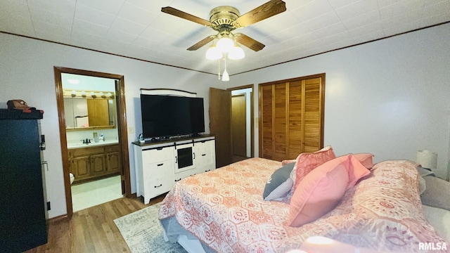 13919 Hamilton Pike Rd, Whittington, IL 62897 - bedroom with wood finished floors, connected bathroom, and ceiling fan