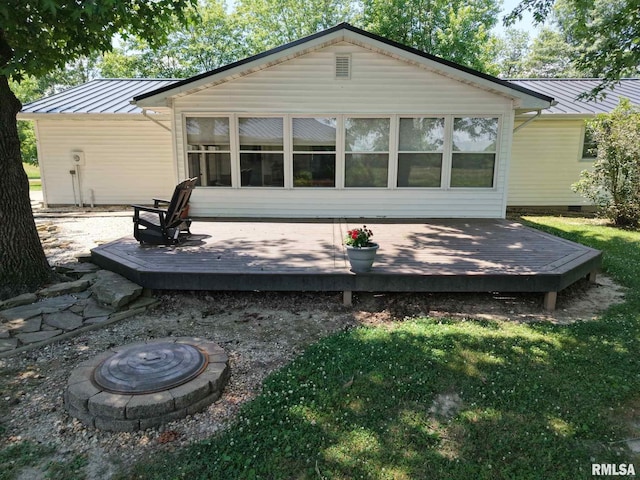13919 Hamilton Pike Rd, Whittington, IL 62897 - back of property with a standing seam roof, a fire pit, a metal roof, and a wooden deck