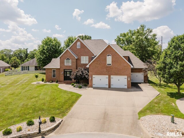 1506 Gleneagle Dr, Marion, IL 62959 - traditional home featuring concrete driveway, a front yard, brick siding, an attached garage, and roof with shingles