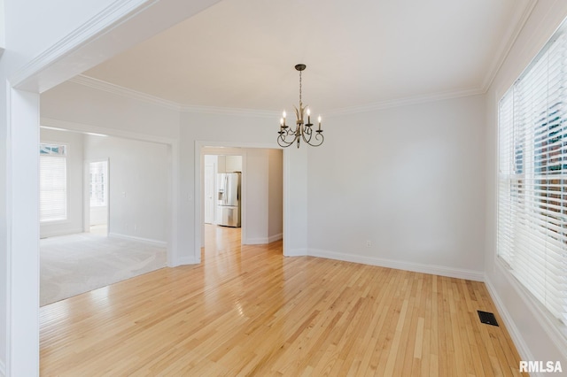 1506 Gleneagle Dr, Marion, IL 62959 - spare room with a chandelier, plenty of natural light, light wood finished floors, and crown molding