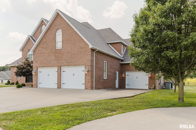 1506 Gleneagle Dr, Marion, IL 62959 - view of side of home with driveway, an attached garage, brick siding, and roof with shingles