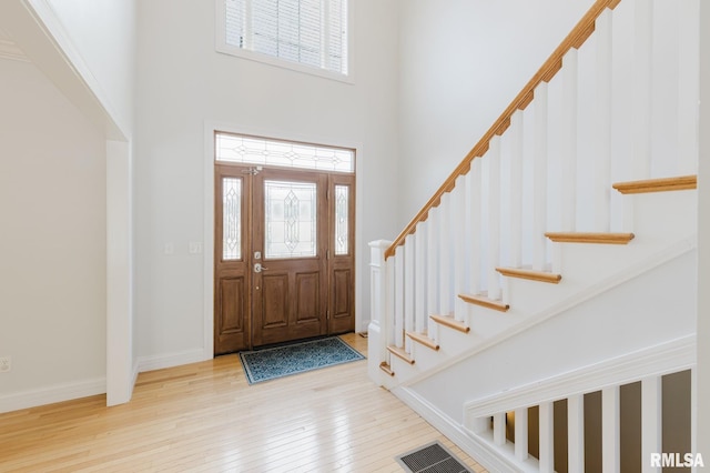 1506 Gleneagle Dr, Marion, IL 62959 - entryway with a towering ceiling, stairway, and wood-type flooring