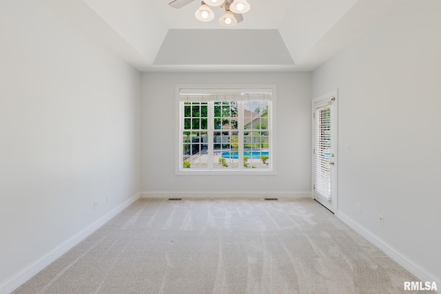1506 Gleneagle Dr, Marion, IL 62959 - carpeted empty room with a tray ceiling and a ceiling fan