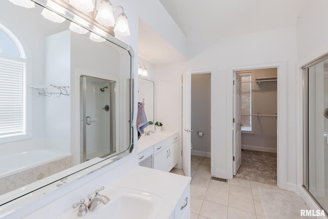 1506 Gleneagle Dr, Marion, IL 62959 - full bath featuring a shower stall, vanity, a spacious closet, and plenty of natural light