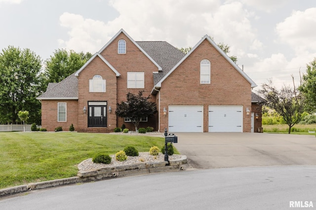 1506 Gleneagle Dr, Marion, IL 62959 - traditional-style house with brick siding, a garage, concrete driveway, a front yard, and roof with shingles