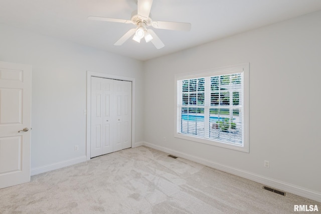 1506 Gleneagle Dr, Marion, IL 62959 - unfurnished bedroom featuring carpet, a closet, and ceiling fan
