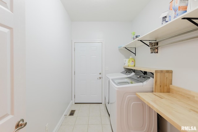 1506 Gleneagle Dr, Marion, IL 62959 - laundry room with washer and dryer and light tile patterned floors