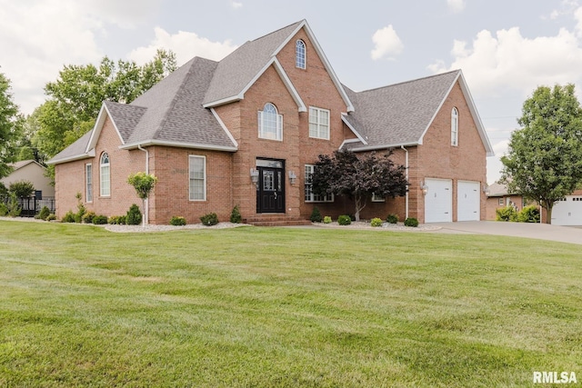 1506 Gleneagle Dr, Marion, IL 62959 - view of front of house with brick siding, roof with shingles, driveway, an attached garage, and a front yard