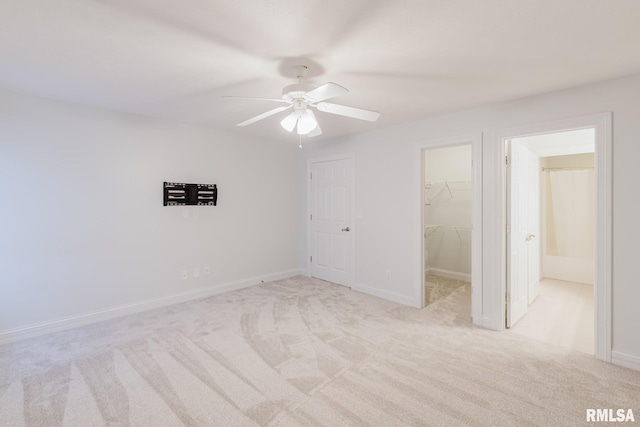 1506 Gleneagle Dr, Marion, IL 62959 - unfurnished bedroom featuring carpet floors, a spacious closet, a closet, and a ceiling fan
