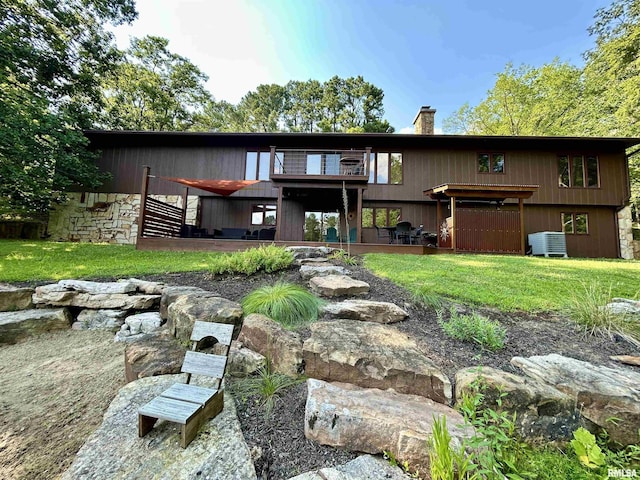 304 May Apple Ln, Carbondale, IL 62903 - back of house with a chimney, a lawn, and a wooden deck