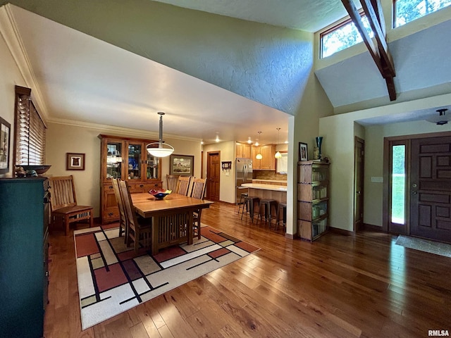 304 May Apple Ln, Carbondale, IL 62903 - dining room featuring hardwood / wood-style flooring, high vaulted ceiling, and crown molding