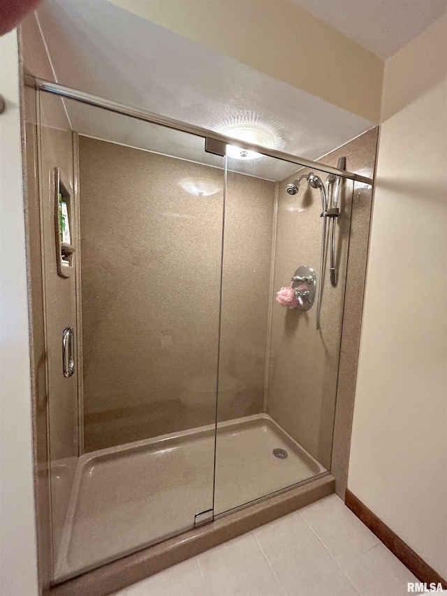 304 May Apple Ln, Carbondale, IL 62903 - bathroom with tile patterned floors and a shower stall