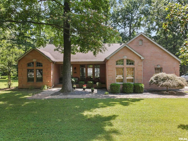 1818 Calico Rd, Marion, IL 62959 - view of front of house featuring a front lawn, brick siding, and roof with shingles