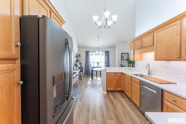 1600 S Eugene Ln, Marion, IL 62959 - kitchen with appliances with stainless steel finishes, a chandelier, light countertops, light wood finished floors, and high vaulted ceiling