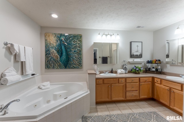 1600 S Eugene Ln, Marion, IL 62959 - bathroom with a jetted tub, double vanity, tile patterned flooring, and a textured ceiling