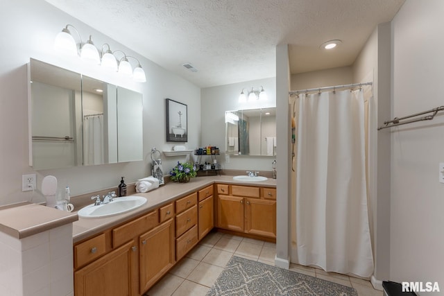 1600 S Eugene Ln, Marion, IL 62959 - full bath featuring tile patterned floors, double vanity, a textured ceiling, recessed lighting, and curtained shower