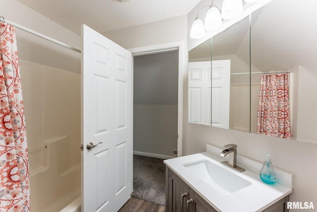 1600 S Eugene Ln, Marion, IL 62959 - bathroom featuring vanity, wood finished floors, vaulted ceiling, and shower / bath combo