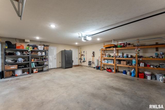 1600 S Eugene Ln, Marion, IL 62959 - garage with freestanding refrigerator, recessed lighting, and a garage door opener