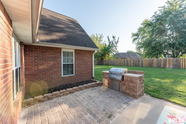 1600 S Eugene Ln, Marion, IL 62959 - fenced backyard featuring exterior kitchen and a patio area