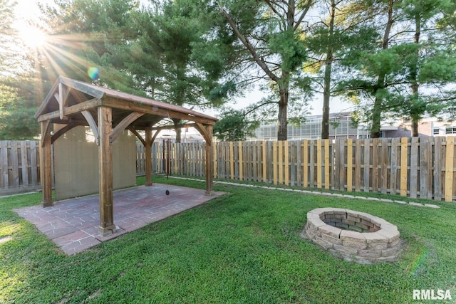 1600 S Eugene Ln, Marion, IL 62959 - fenced backyard featuring a fire pit, a gazebo, and a patio