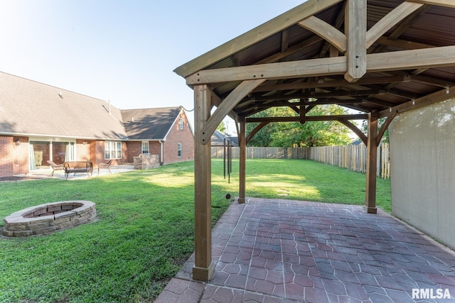1600 S Eugene Ln, Marion, IL 62959 - fenced backyard with an outdoor fire pit, a patio area, and a gazebo