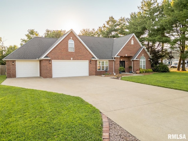 1600 S Eugene Ln, Marion, IL 62959 - traditional-style house featuring a front yard, brick siding, driveway, and a garage