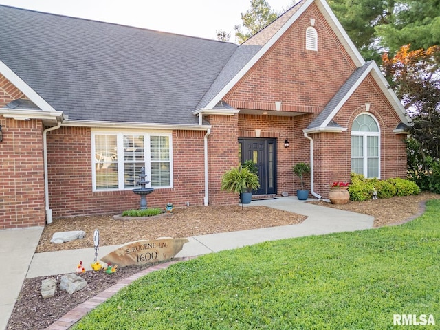 1600 S Eugene Ln, Marion, IL 62959 - view of front of house with brick siding, a front lawn, and a shingled roof