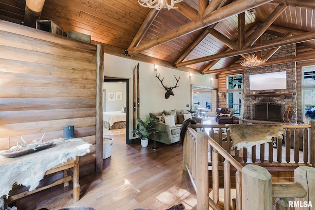 3525 Parrish Ridge Ln, Goreville, IL 62939 - living area with a wood ceiling with exposed beams, a chandelier, wood-type flooring, a fireplace, and high vaulted ceiling