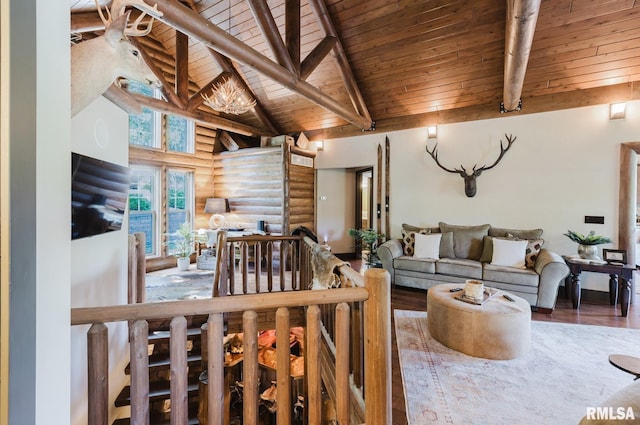 3525 Parrish Ridge Ln, Goreville, IL 62939 - living area featuring a wood ceiling with exposed beams, rustic walls, wood finished floors, and high vaulted ceiling